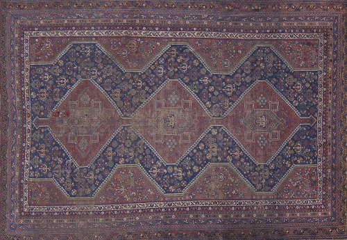 Alfombra en lana con campo azul y cartuchos geométricos en 