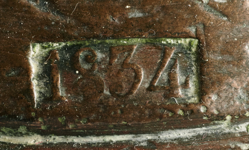 Pareja de pesas en bronce marcadas con el  anagrama de Isab