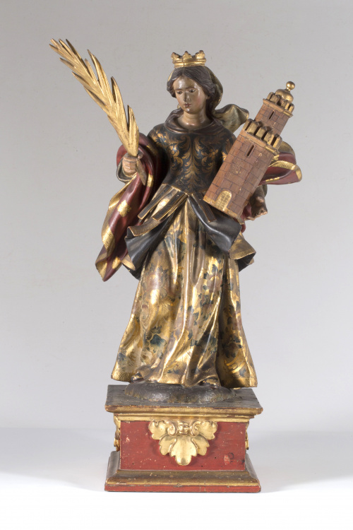 “Santa Bárbara” escultura en madera tallada, dorada y polic
