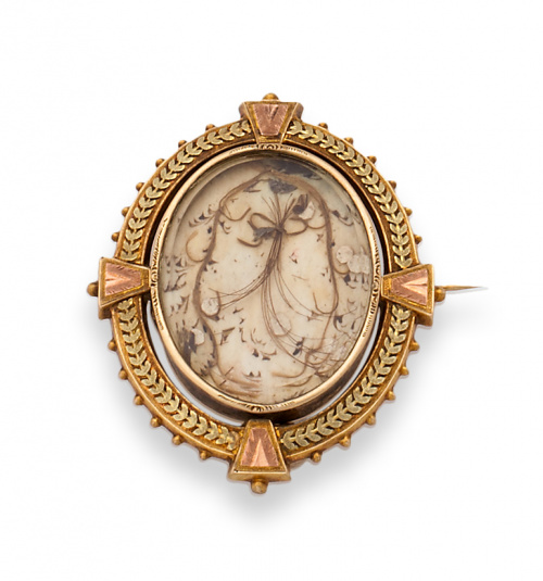 Broche guardapelo s.XIX con marco oval en oro bicolor de 18
