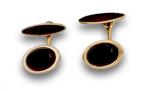 Gemelos Krementz ovalados años 40 con vidrio rojo en metal 