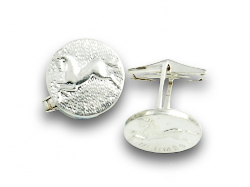 Gemelos circulares HERMES en metal plateado.