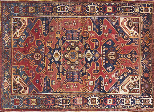 Alfombra en lana Kazak de campo azul y cartuchos en rojoT
