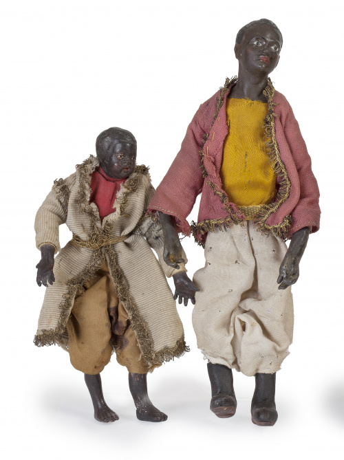 Dos figuras de pajes de belén en madera y estopa.Trabajo 