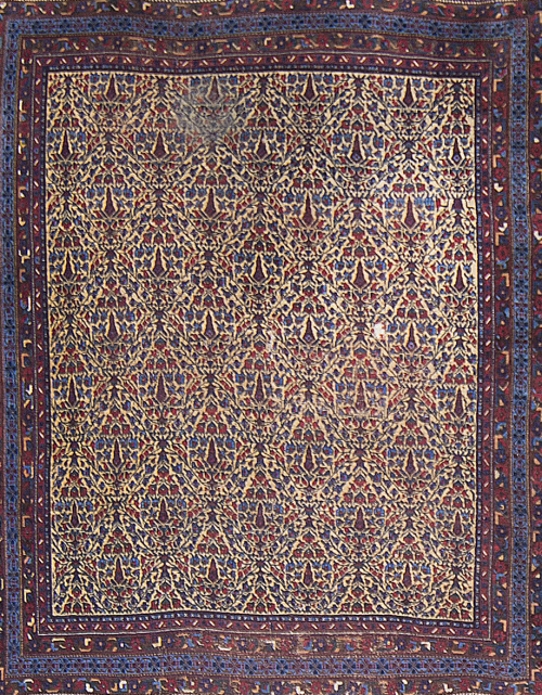 Alfombra en lana de profusa decoración vegetal, Persia.