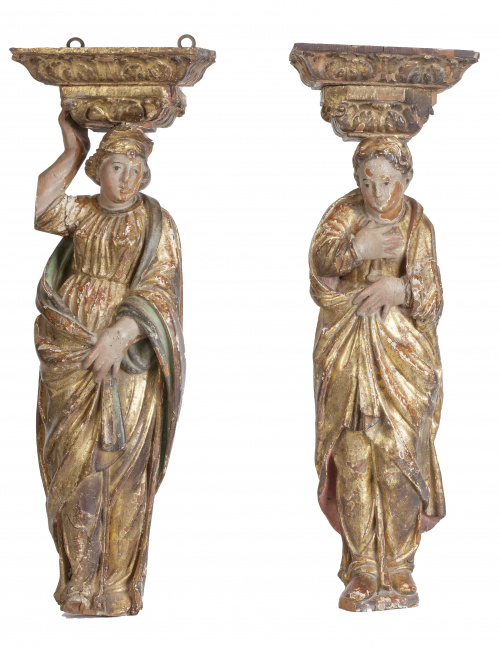 Pareja de cariátides en madera tallada, dorada y policromad