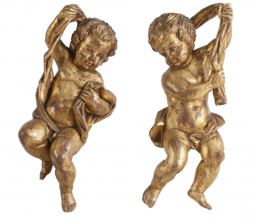 Pareja de niños en madera tallada y dorada, S. XVIII