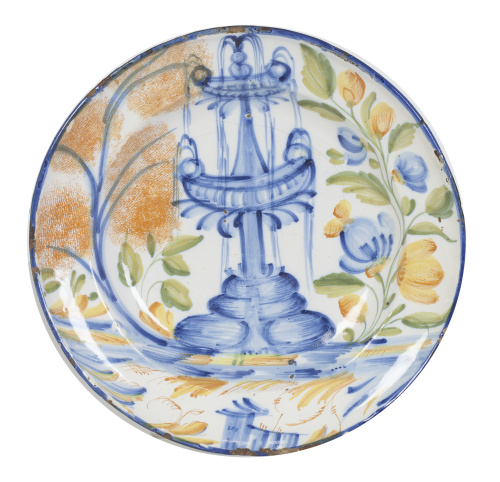Plato de cerámica esmaltada en azul cobalto y ocre con fuen