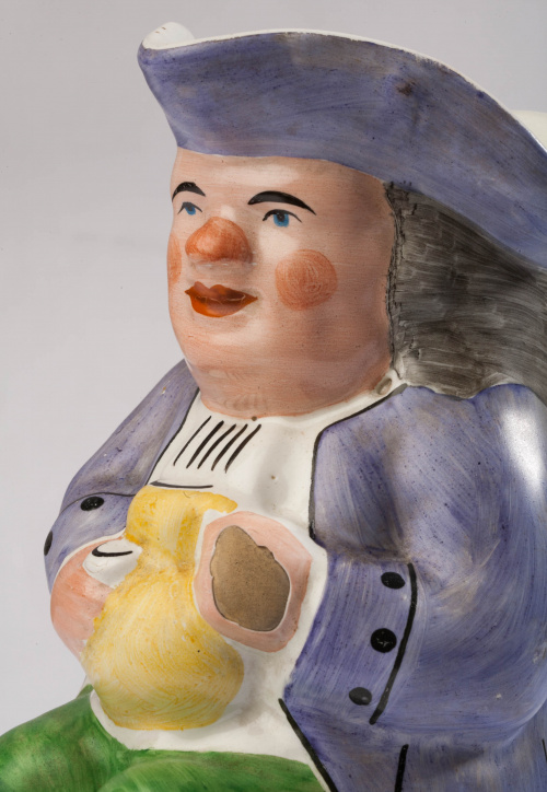 "Toby-jug" en cerámica esmaltada, con la leyenda "Tarry ere