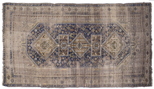 Alfombra en lana de campo azul y cartuchos en beige, Persia.