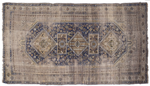 Alfombra en lana de campo azul y cartuchos en beige, Persia.