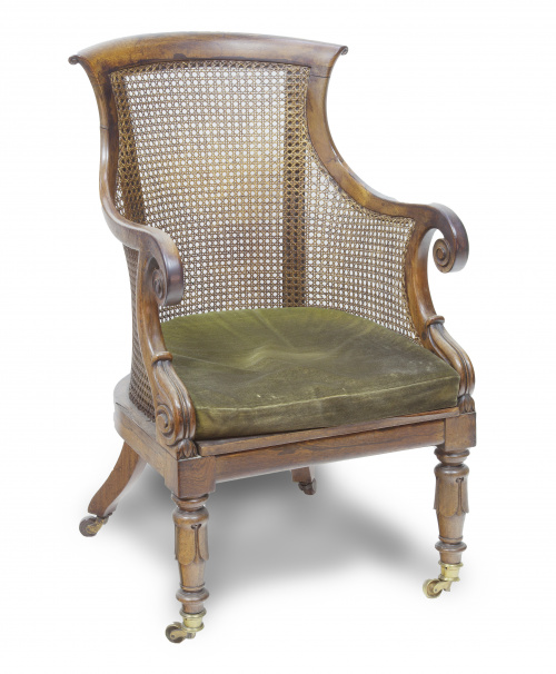 Butaca de biblioteca de madera de palosanto y asiento cané.