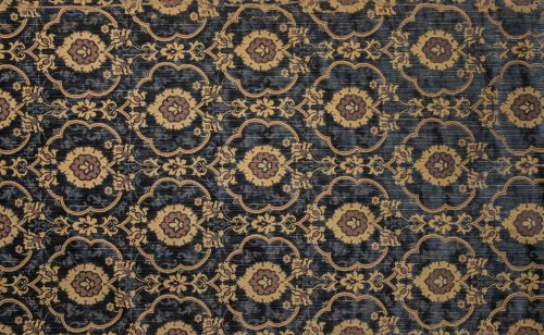 Dos fragmentos de brocado en terciopelo azul con decoración