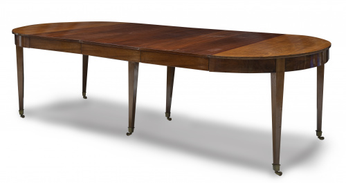 Mesa de comedor directorio extensible en madera de caoba.