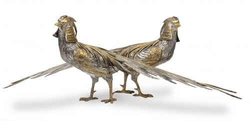 Lote de dos faisanes decorativos en plata y plata dorada.