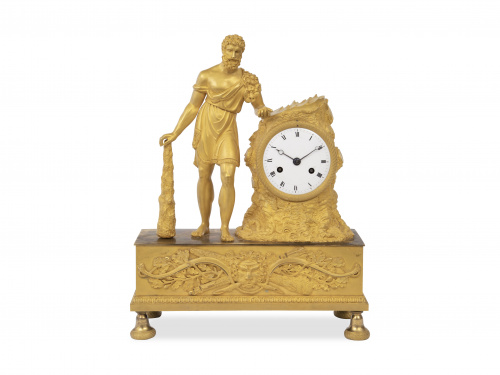 Reloj en bronce dorado, con la figura de Hércules, sobre pl