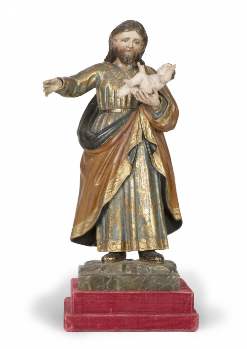San José con el Niño.Escultura en madera tallada, estucad