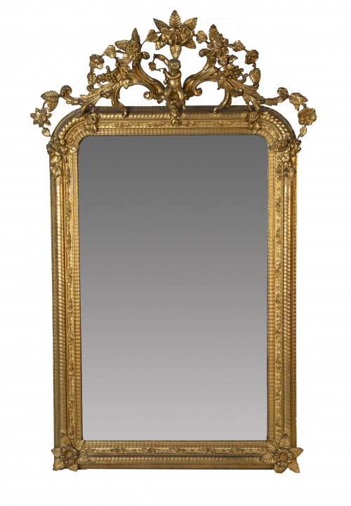 Espejo isabelino en madera tallada y dorada.España, S. XI