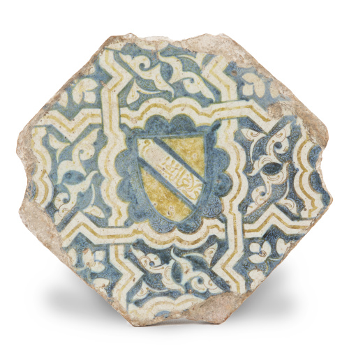 Azulejo octogonal de cerámica esmaltada en azul y ocre.Tr