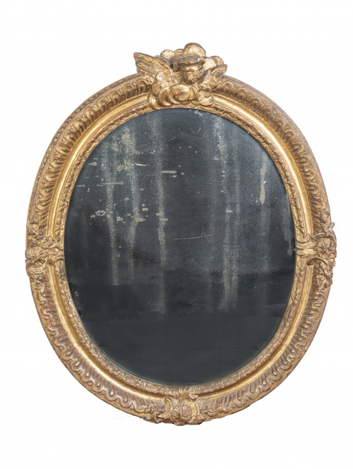 Pareja de espejos ovales regencia en madera tallada y dorad