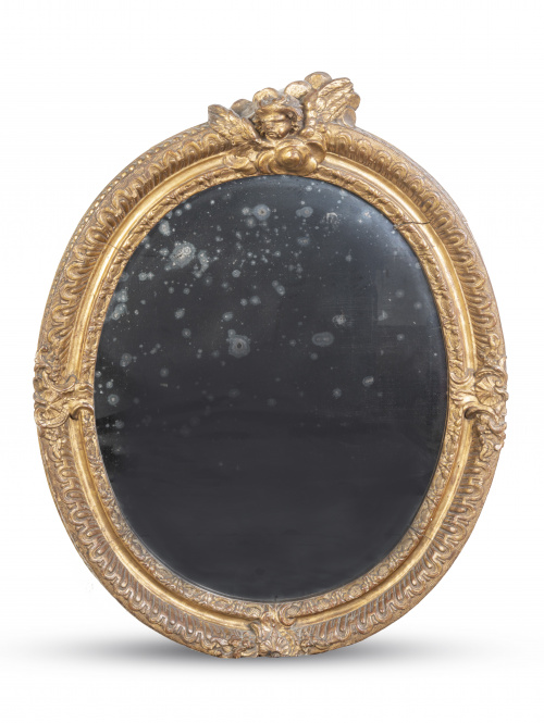 Pareja de espejos ovales regencia en madera tallada y dorad