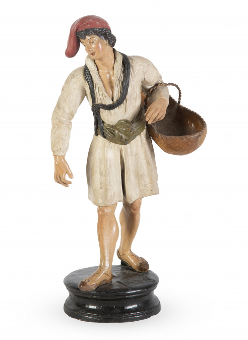 Vendedor.Figura en barro cocido y policromadoMarcado An