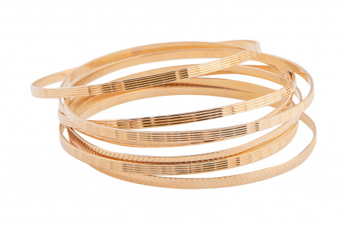 Semanario formado por siete brazaletes circulares de oro gr