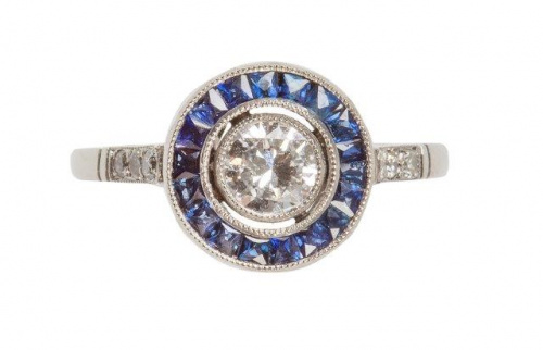 Sortija ojo de perdiz con chatón central de 0, 47ct, orlado