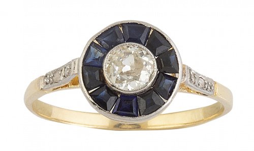 Sortija ojo de perdiz con brillante central de 0,35 ct orla