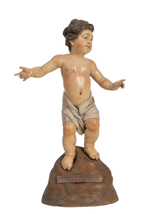 Niño Jesús.Madera tallada, tela encolada y ojos de pasta 