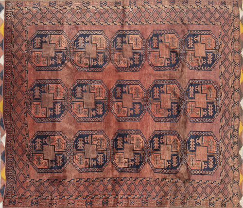 Antigua alfombra Bukhara con dibujo de patas de elefante.