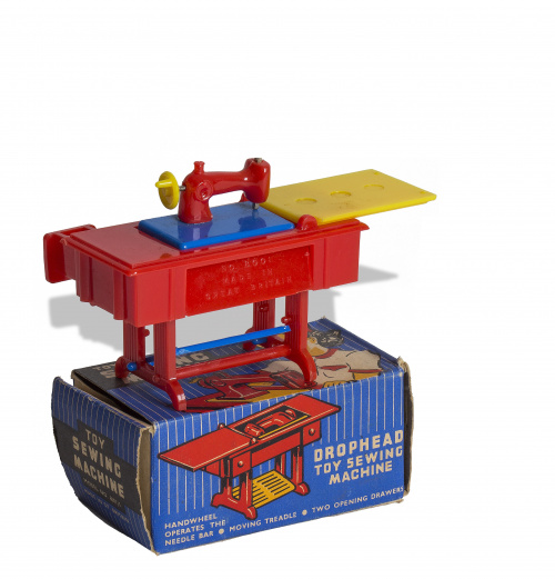 Máquina de coser de juguete de plástico rojo y amarillo, co