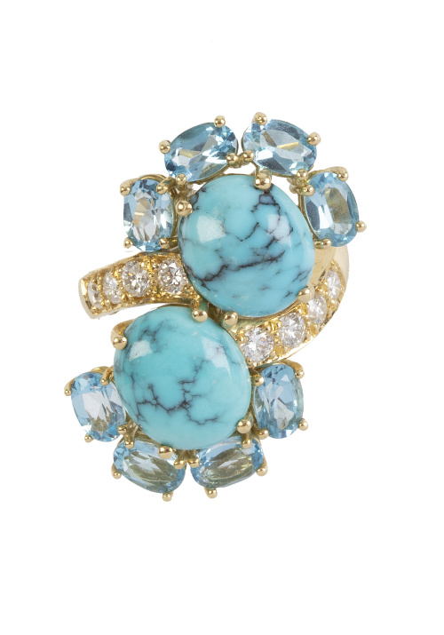 Sortija lanzadera de cabujones de turquesa y ocho topacios 