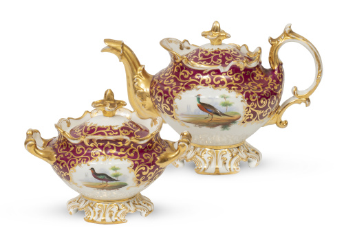 Azucarero y tetera de porcelana esmaltada y dorada con aves