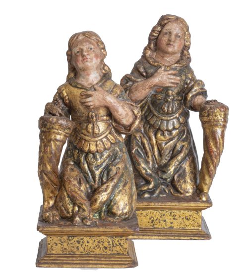 Pareja de niños con cuernos de la abundancia de tela encola