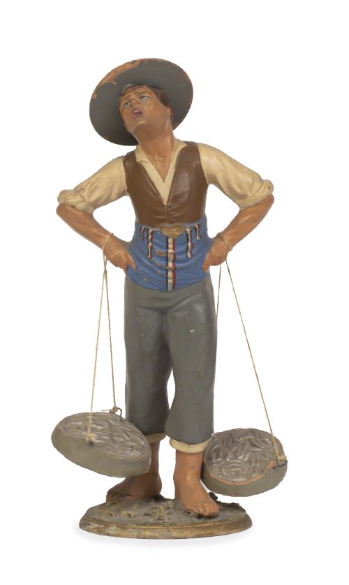 El cenachero.Figura de barro policromado.Trabajo malagu