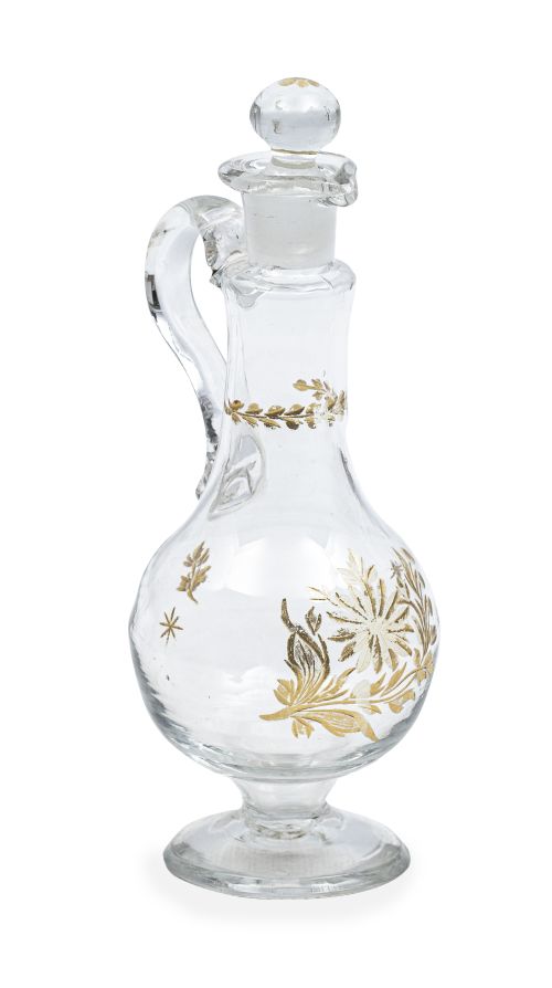 Vinagrera con asa de vidrio transparente con flores y hojas