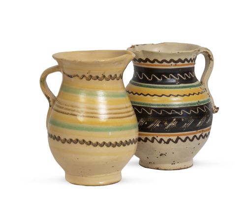 Lote de dos jarras de cerámica esmaltada en ocre, managanes