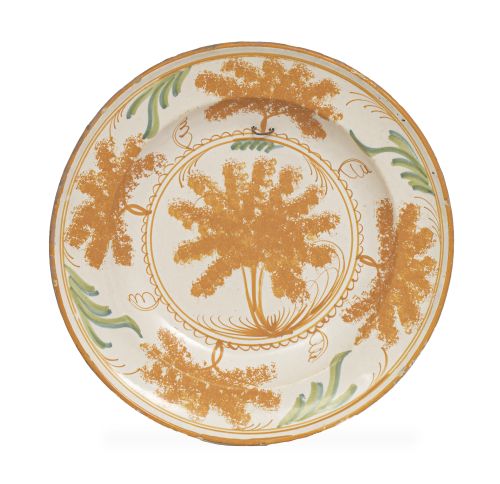 Plato de cerámica esmaltada con decoración esponjada de árb