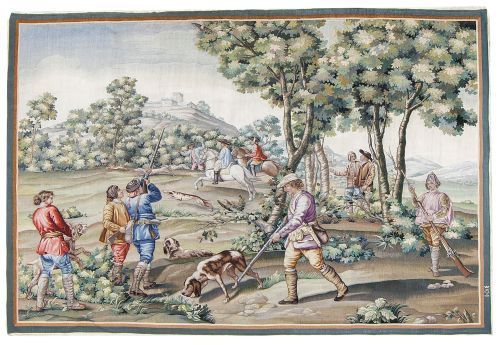 "La partida de caza y el cazador cargando la escopeta".Ta