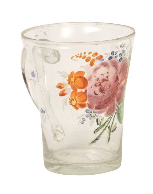 Jarrita de vidrio transparente pintado con flores pintadas.